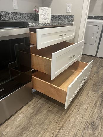 A kitchen with a stove top oven and a dishwasher.